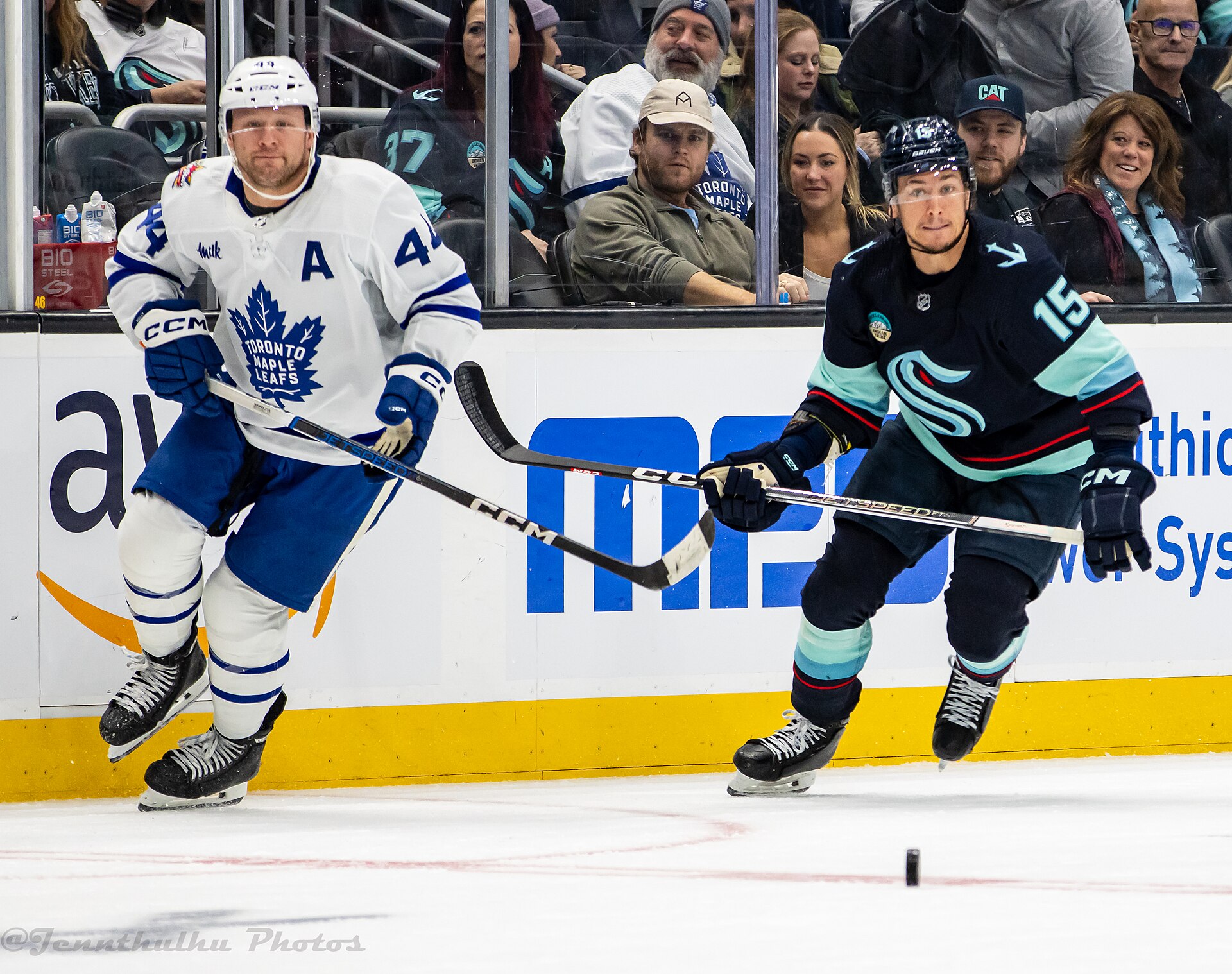 Morgan Rielly of the Maple Leafs battles John Hayden of the Kraken in Seattle in January 2024