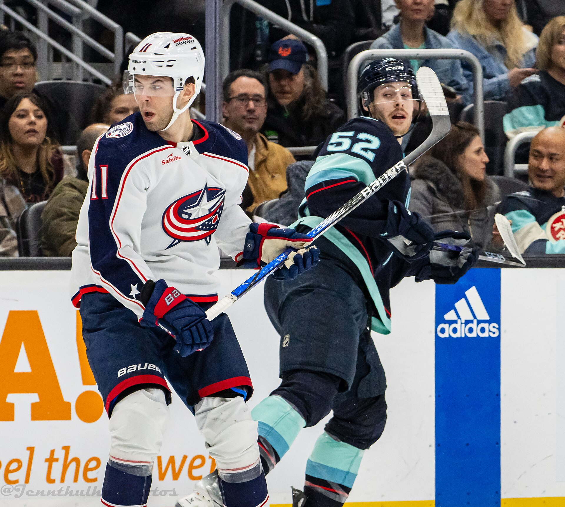 Adam Fantilli of the Columbus Blue Jackets battles Seattle's Tye Kartye during a January 2024 game in Seattle